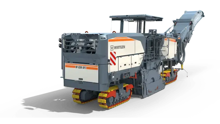 Construction machine with conveyor belt on dark background.
